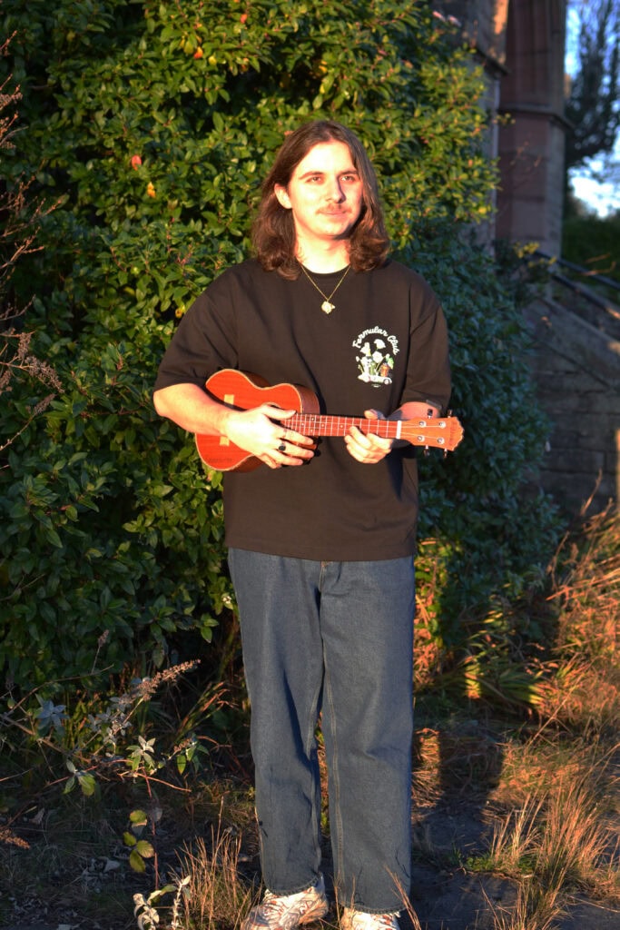 Adam Maghout standing ukulele