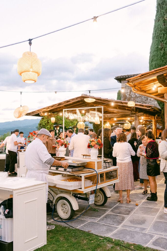 Guests eating during an Italian wedding welcome party