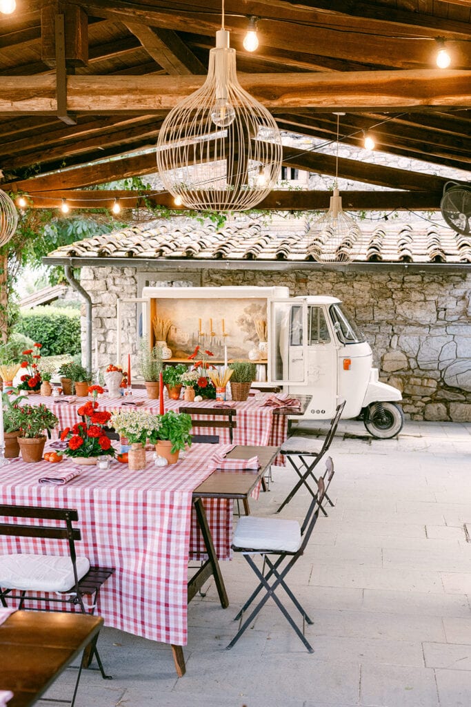 Rustic Tuscany wedding welcome party with candlelit tables