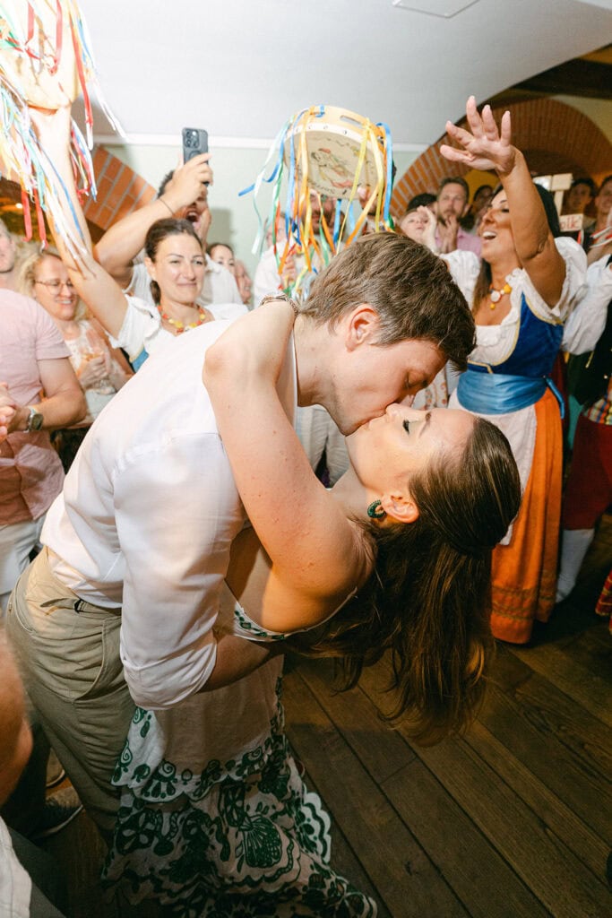 Couple celebrating with guests before their destination wedding in Italy