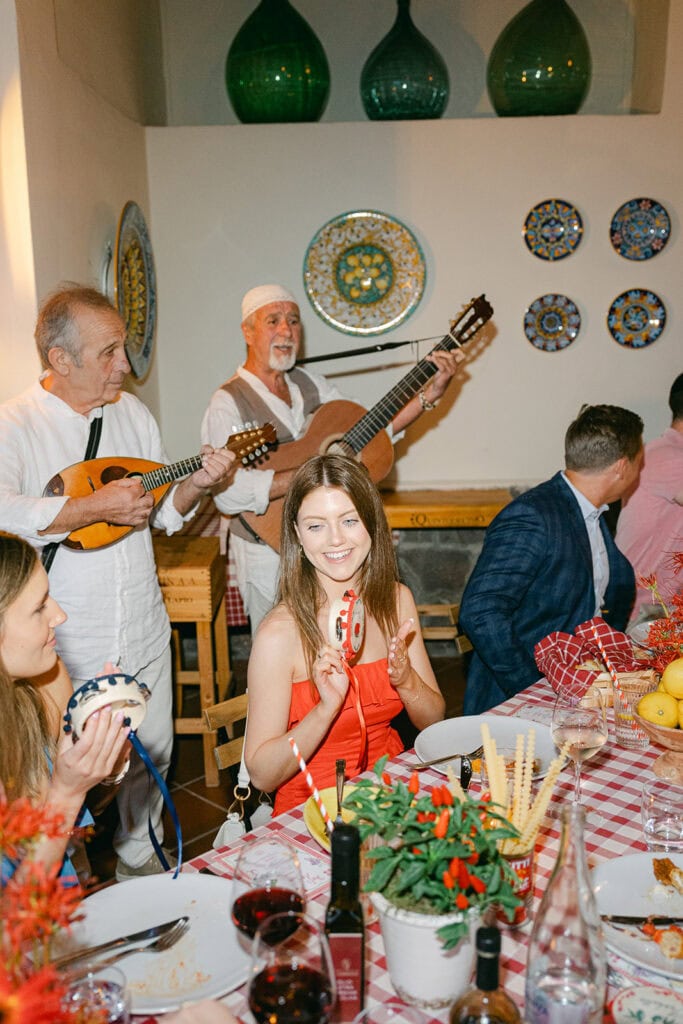 Guests enjoying a wedding welcome party in Italy with live music