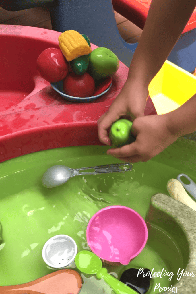 playing with toy veggies in water