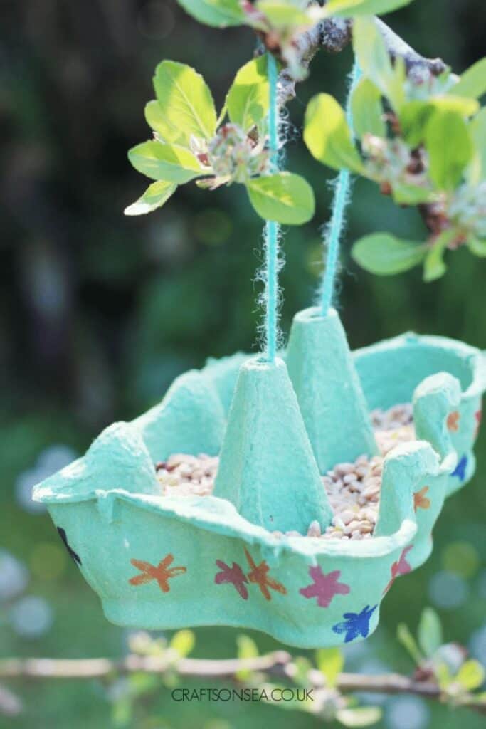 bird feeder craft hanging on tree branch