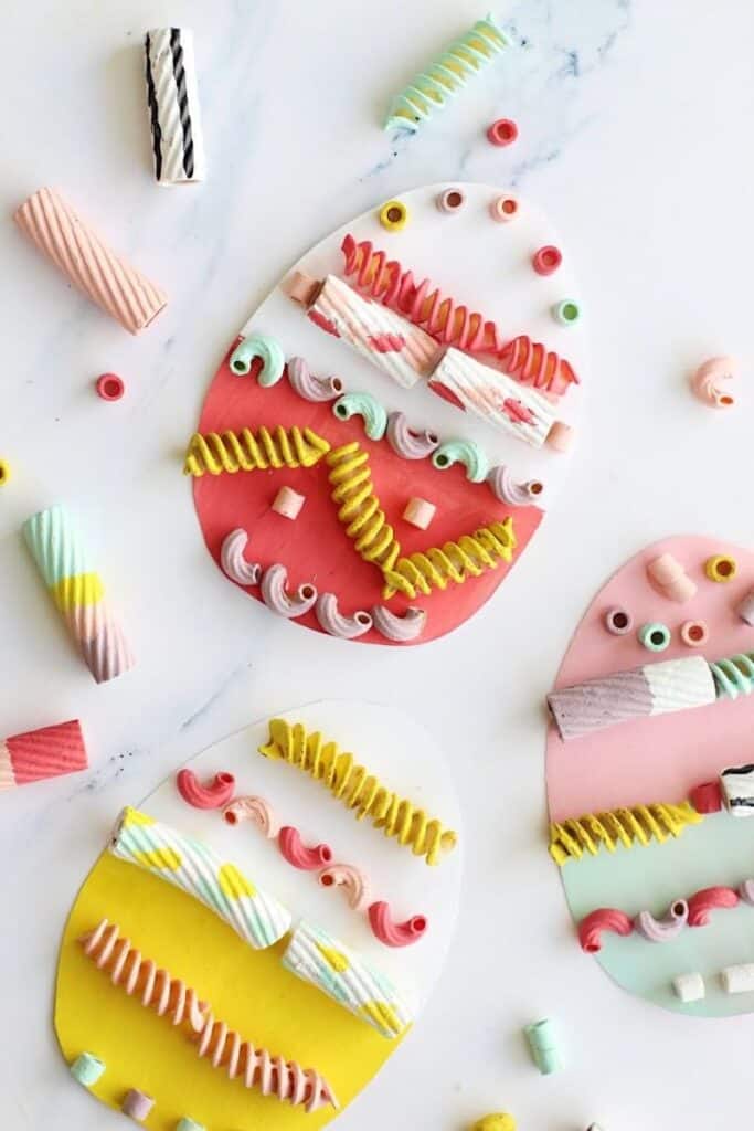 cardboard eggs decorated with painted pasta