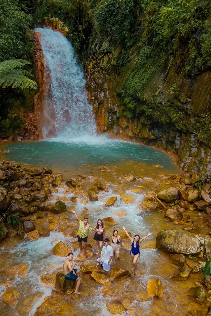 A picture of some visitors enjoying the Pulangbato Falls