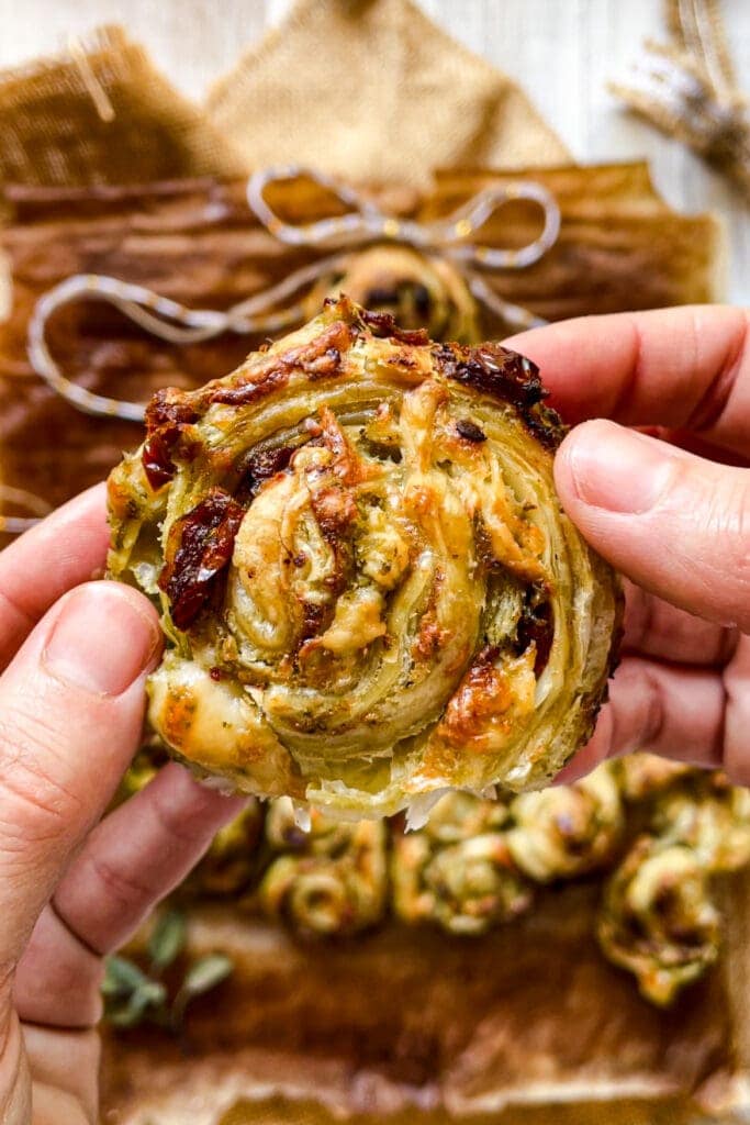 Paula's Apron 5-Ingredient Savoury Puff Pastry Christmas Tree All you need is 5 simple ingredients for this easy but impressive Savoury Puff Pastry Christmas Tree! It’s filled with pesto, sun-dried tomatoes and cheese, which are delicious ingredients with beautiful christmassy colours. Store bought puff pastry brings it all together without much effort. Oh! And what's even better is that you can assemble this pesto, tomato and cheese puff pastry ahead, so one less thing to worry about on Christmas day. | Paula's Apron Recipe