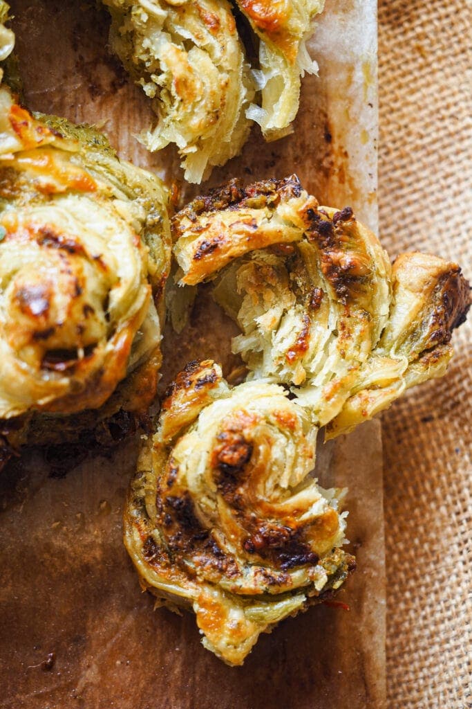 Paula's Apron 5-Ingredient Savoury Puff Pastry Christmas Tree All you need is 5 simple ingredients for this easy but impressive Savoury Puff Pastry Christmas Tree! It’s filled with pesto, sun-dried tomatoes and cheese, which are delicious ingredients with beautiful christmassy colours. Store bought puff pastry brings it all together without much effort. Oh! And what's even better is that you can assemble this pesto, tomato and cheese puff pastry ahead, so one less thing to worry about on Christmas day. | Paula's Apron Recipe