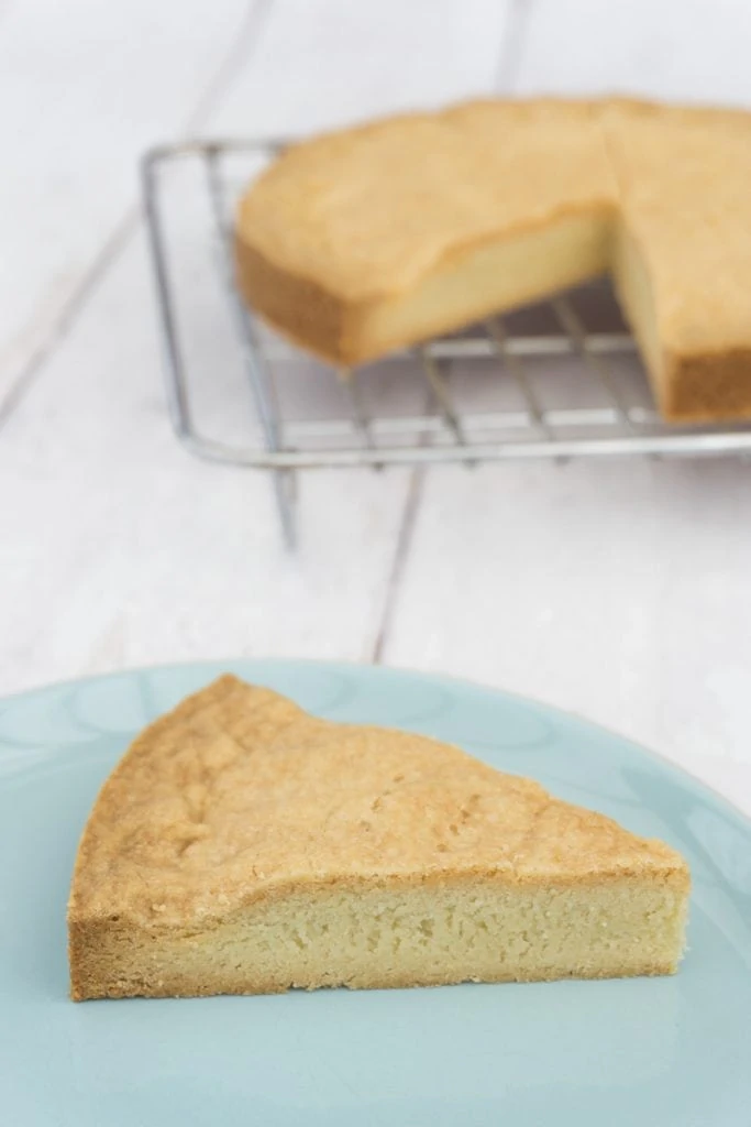 Shortbread round recipe cut into pieces and one on a plate