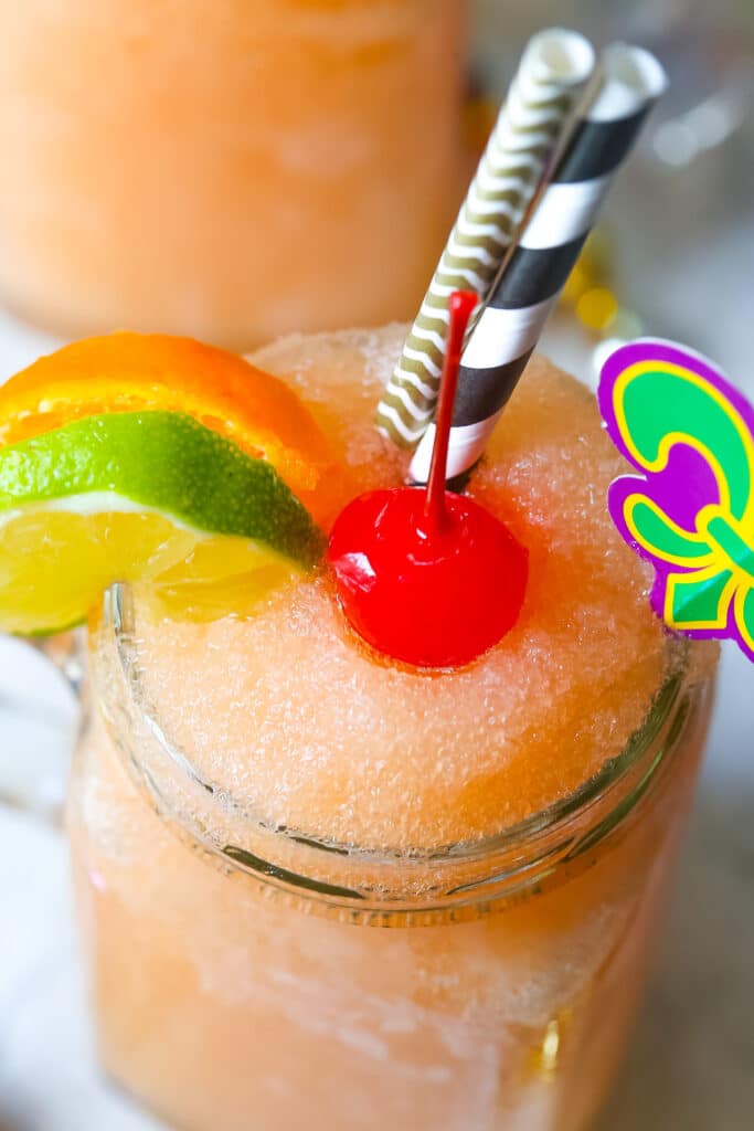 close up of frozen drink with a maraschino cherry in frozen drink