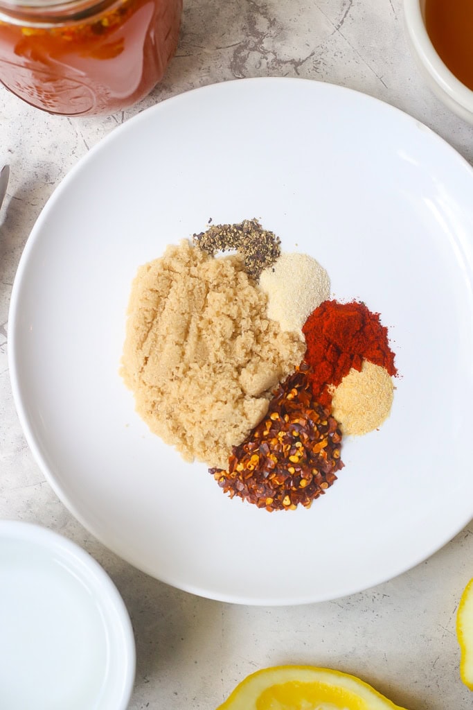 brown sugar and spices on a white plate to make vinegar based bbq sauce