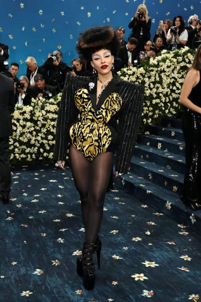 Statement bodysuit in gold and black at the Met Gala 2025, fusing 1980s power dressing with the radical elegance of modern Black fashion.