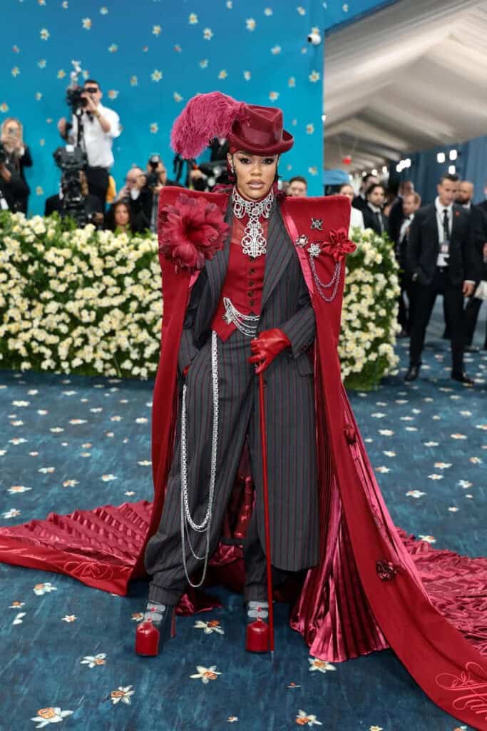 Avant-garde red and pinstripe ensemble at the Met Gala 2025, merging Black Dandyism with theatrical tailoring and luxury craftsmanship.