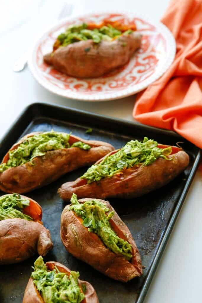 Enjoy a dairy-free and flavorful dish when preparing the Pesto Chicken Stuffed Sweet Potatoes. You can prepare this Whole 30 recipe in less than two hours. You will love how easy this sweet potato recipe is to make. This baked sweet potatoes recipe is so delicious.