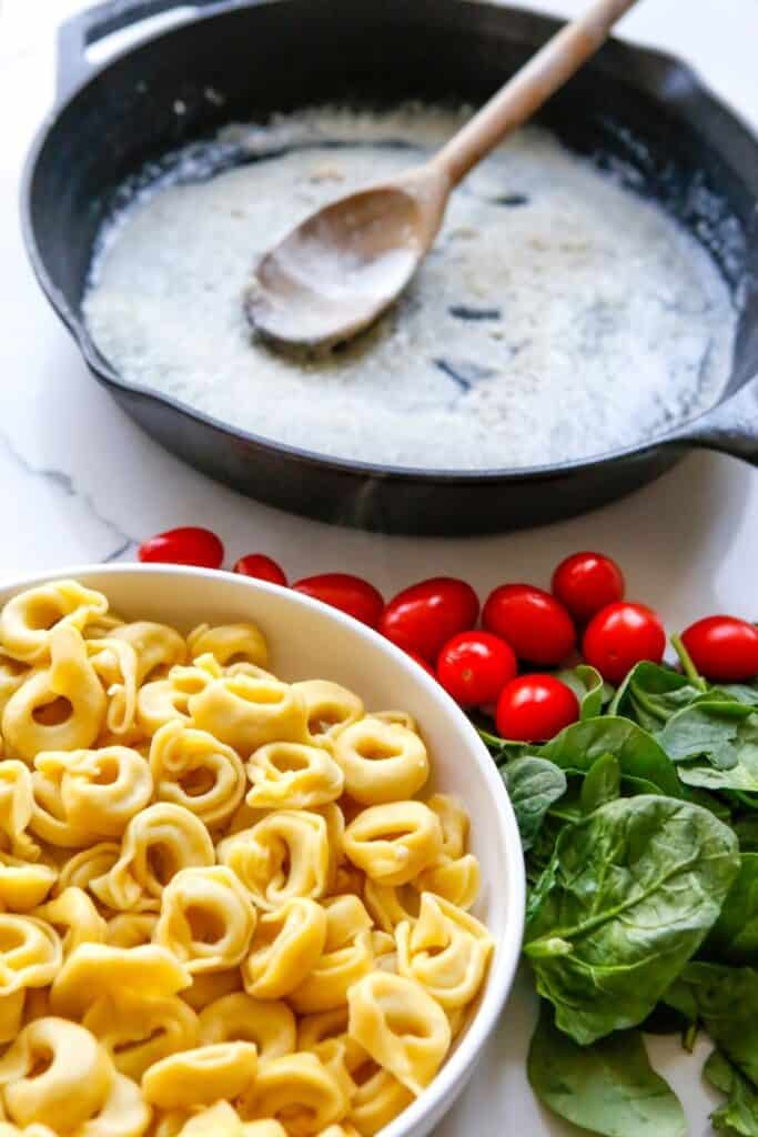 Enjoy the fresh taste of tortellini, shredded cheese, baby spinach, and tomatoes mixed to create this tasty and fulfilling Creamy Tortellini Pasta Skillet