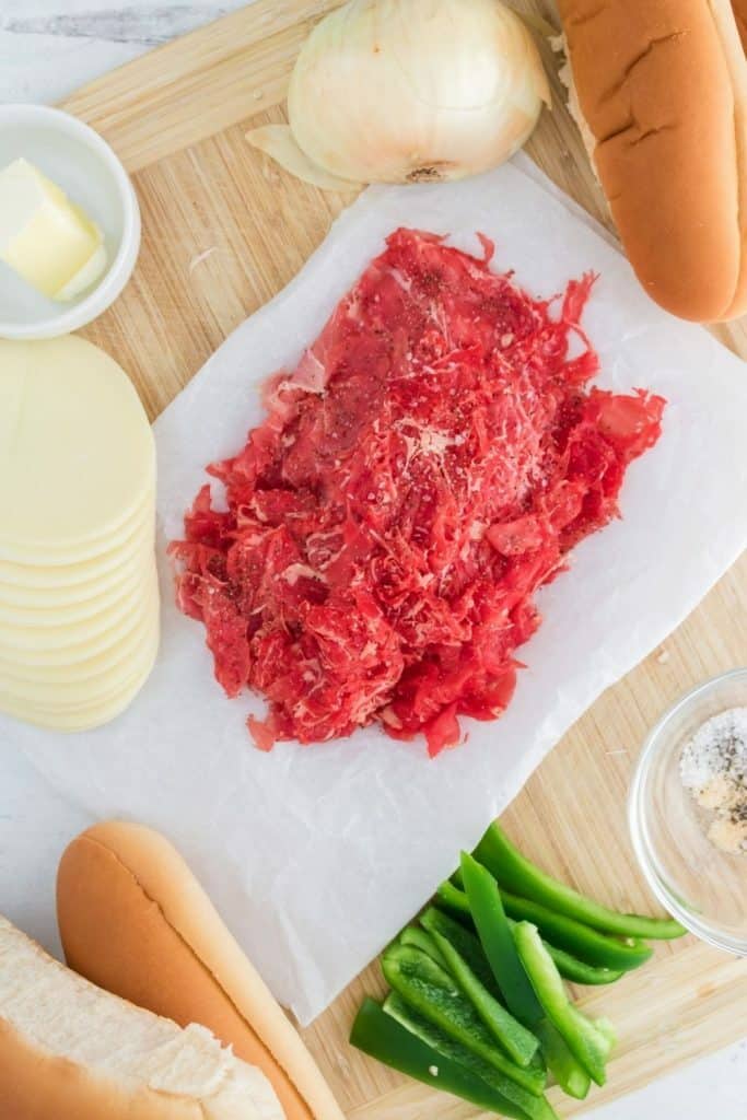 Enjoy the fresh flavor of a thinly sliced steak with cheese, onions, and peppers on rolls with this recipe for homemade Philly Cheesesteaks. If you’ve ever visited Philly (or any of the towns surrounding Philadelphia), you know that they are best known for the famous Philly Cheesesteak. This easy cheesesteak recipe is great to have for lunch and dinner.