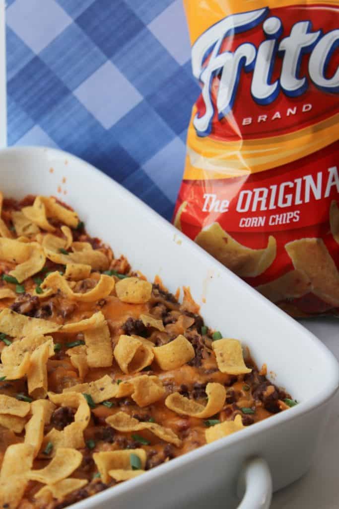 Looking for a simple easy weeknight dinner that the entire family can enjoy? You'll want to grab a bag of Fritos and try this easy and delicious Walking Taco Casserole!