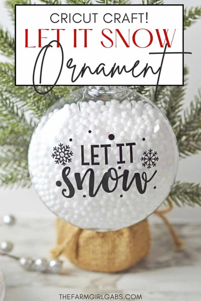 Who says you need the most expensive ornaments to make your Christmas tree look amazing? Learn how to easily create the most beautiful Let It Snow Ornament to hang on the tree or give as a gift. This DIY Ornament is an easy holiday Cricut Craft Idea. It is a great homemade Christmas gift craft idea.