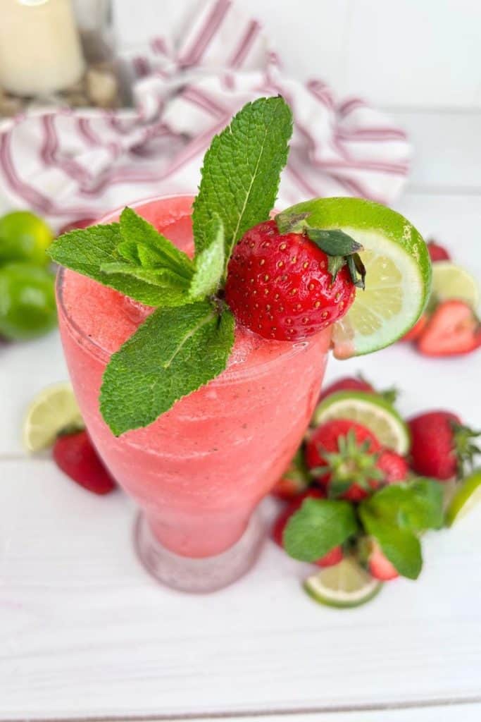 Enjoy this summertime drink that is so good! This frozen Strawberry Mojito is full of flavor and is super easy to make. This easy summer drink recipe is slightly sweet with a zesty punch from adding fresh and flavorful lime juice to the mix.