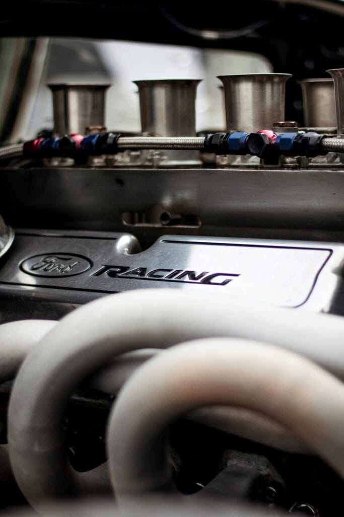 Race-prepared engine with intake trumpets and exhaust manifold