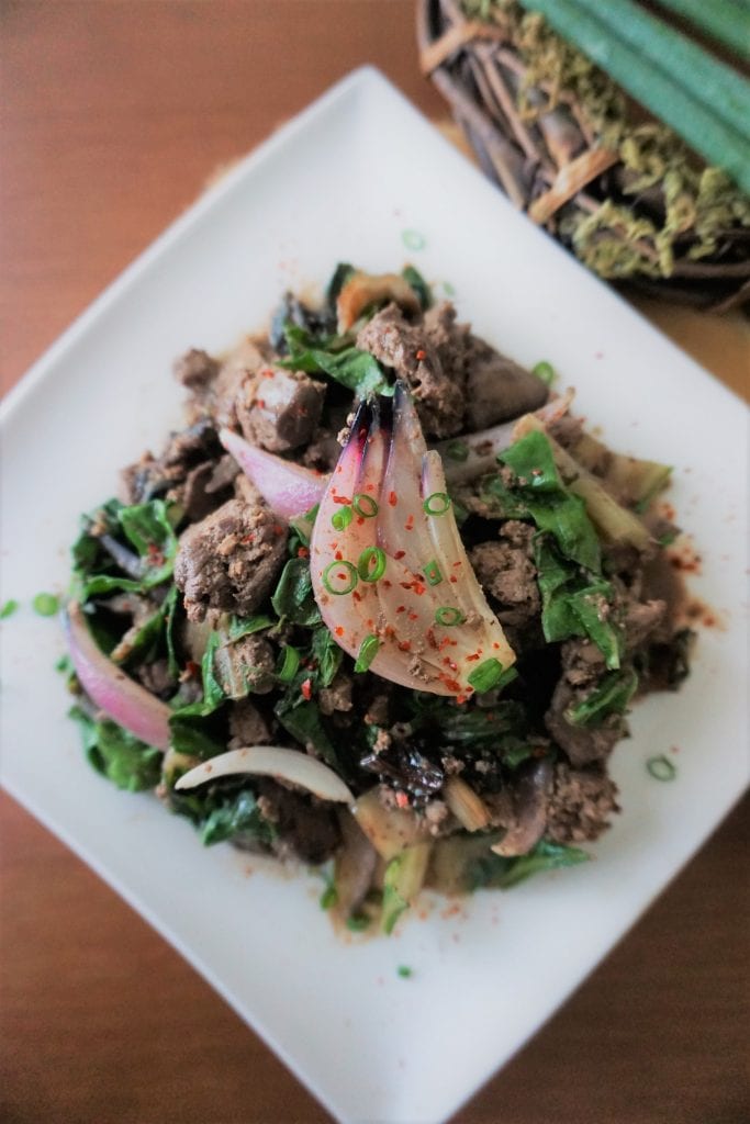 Chicken liver and onions with swiss chard top view