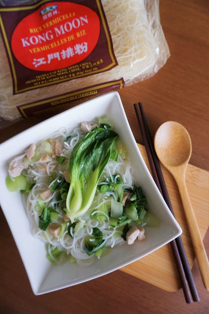 Shanghainese noodle soup with tender chicken with vermicelli package on top of picture