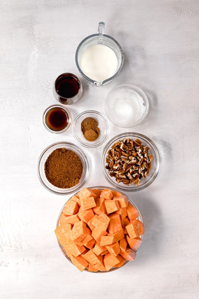 displayed ingredients to make paleo sweet potato casserole in glass bowls