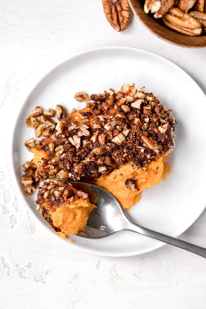 close up of paleo sweet potato casserole on a small round white plate