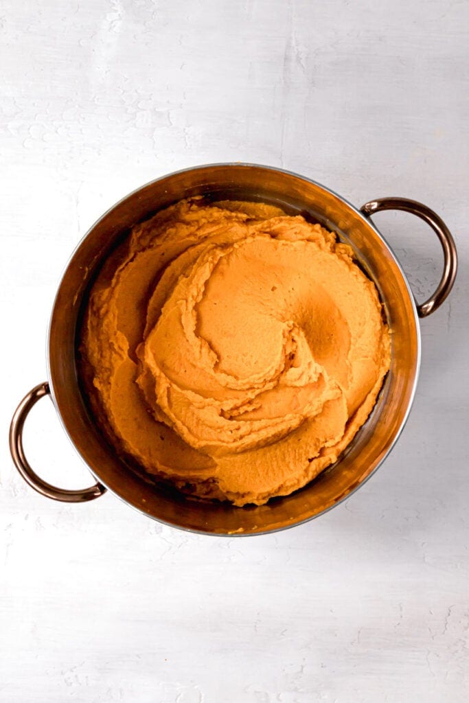 sweet potatoes mashed and swirled in a stock pot