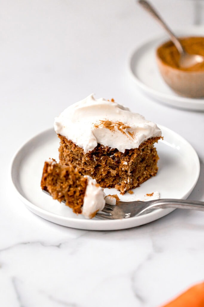 carrot cake on a white round plate
