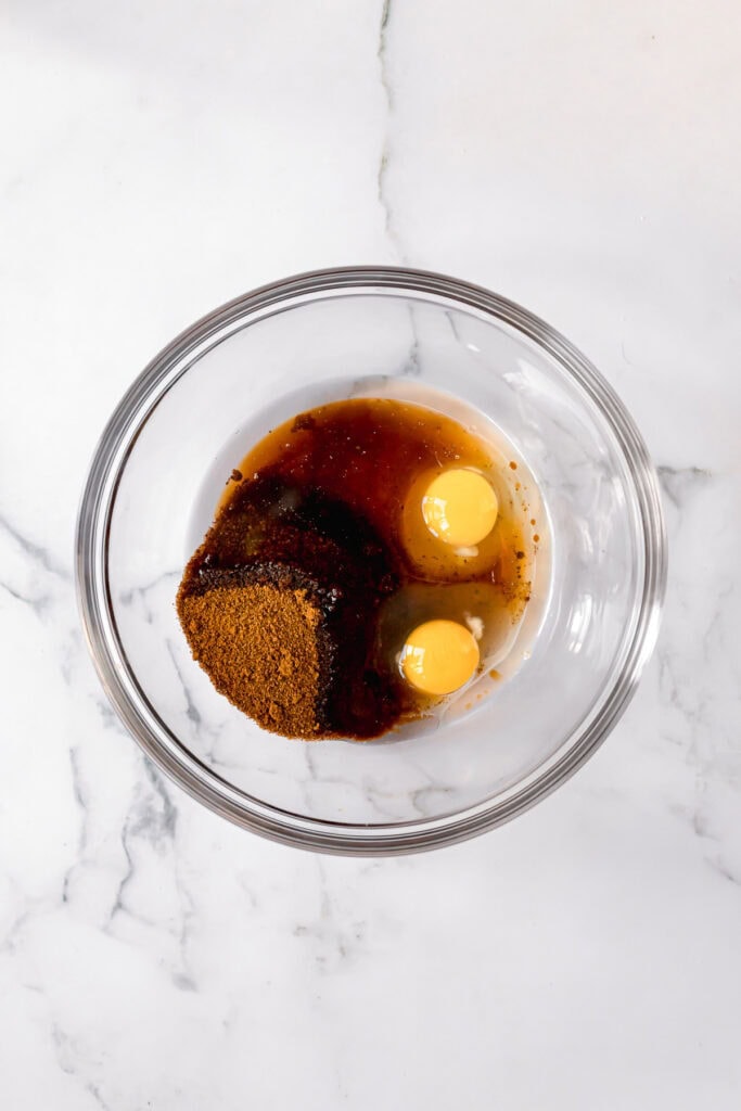 ingredients to make paleo carrot cake in a glass bowl