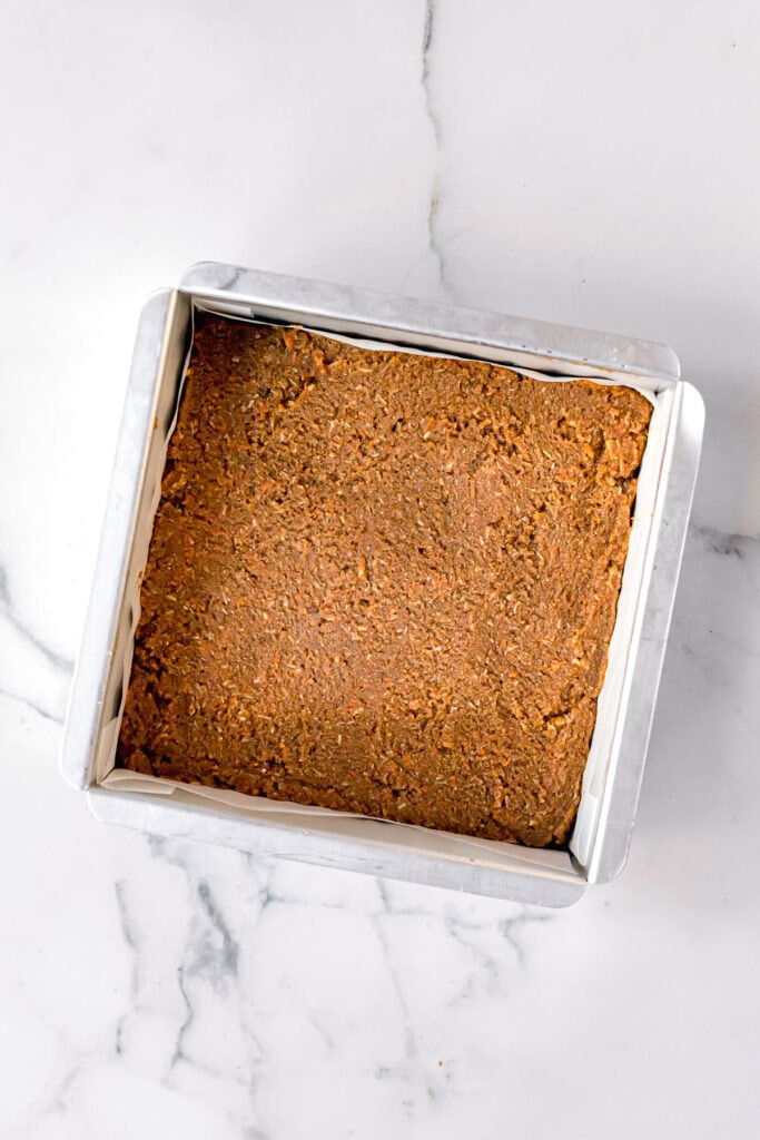 overview of paleo carrot cake in a square baking pan