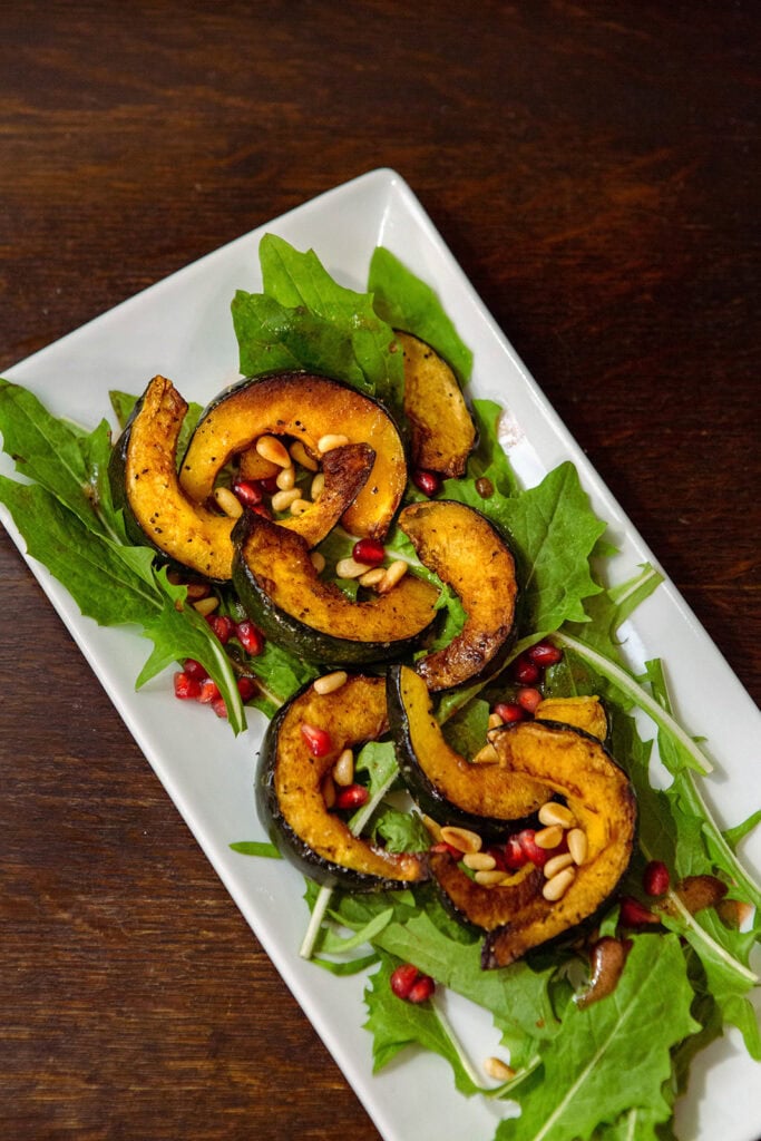 dandelion salad pomegranate seeds pine nuts delicata squash