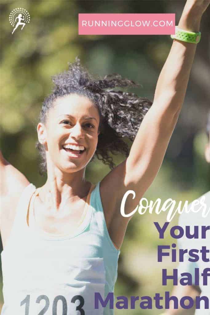 female runner arms up celebrating
