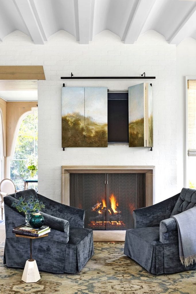 fireplace decorating ideas 57 Easy Fireplace Decorating Ideas That’ll Look Stylish All Year Long hbx020119hidetv01 1554906548 683x1024