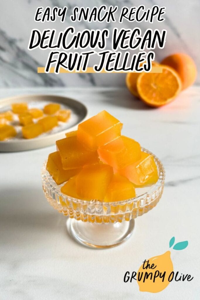 Vegan Fruit Jellies - Easy Homemade Pates Des Fruits 10 pin image vegan fruit jellies on a cake stand, more fruit jellies on a plate in the back with sugar, oranges and a glass of orange juice, on a marble background