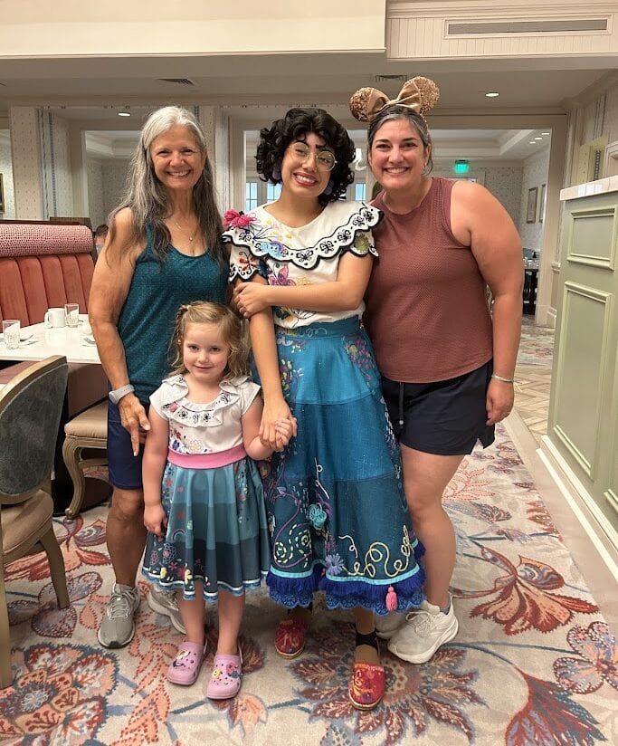 Happy group of women and a young girl enjoying a fun moment together at 407 and Beyond Vacation Co.