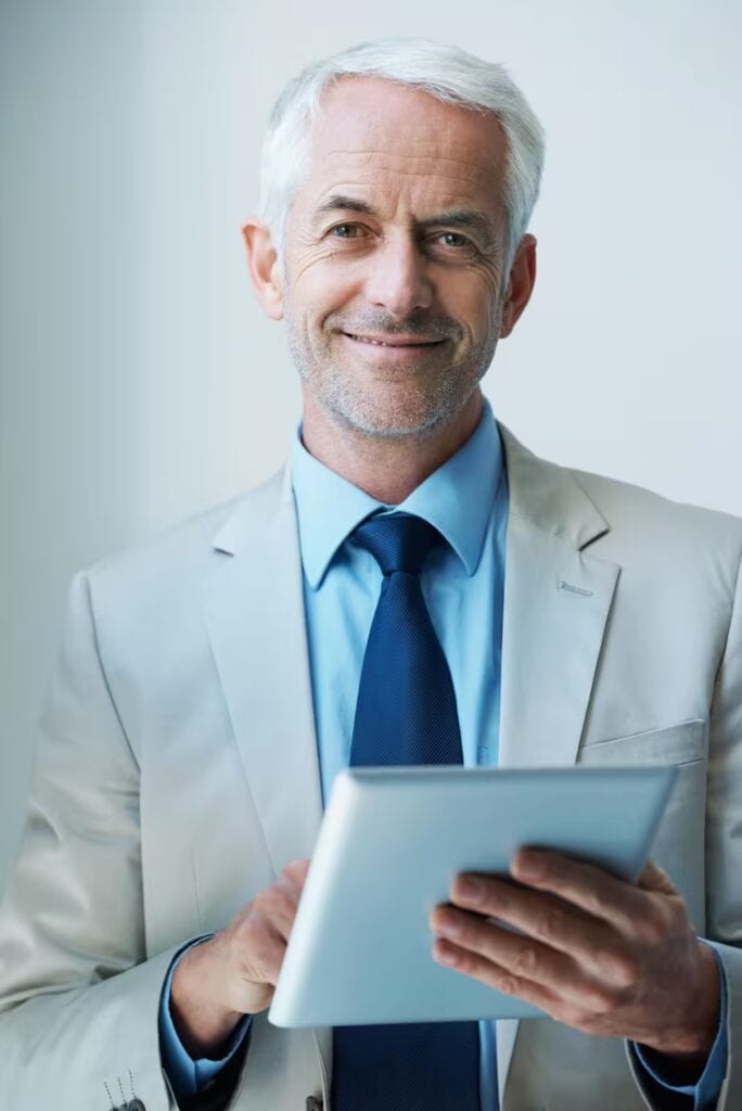 Confident investor with tablet, assuring a real estate secured financial future.