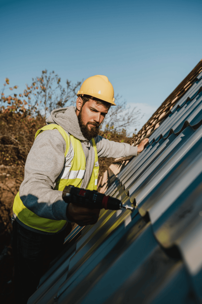 An experienced roofer working on a residential rooftop with precision. Get a free estimate today.
