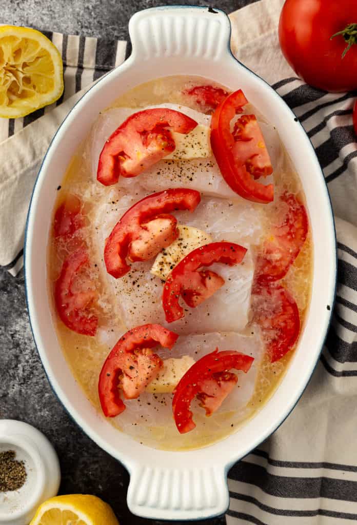 cod cooked in the oven with tomatoes and white wine