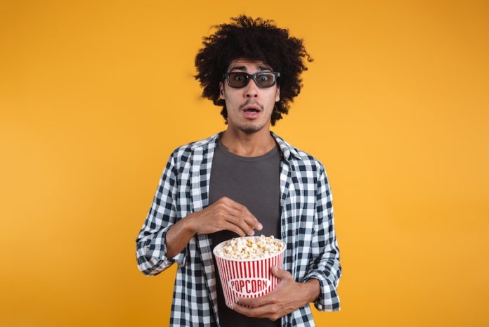 Portrait of a scared afro american man in 3d glasses Portrait of a scared afro american man in 3d glasses