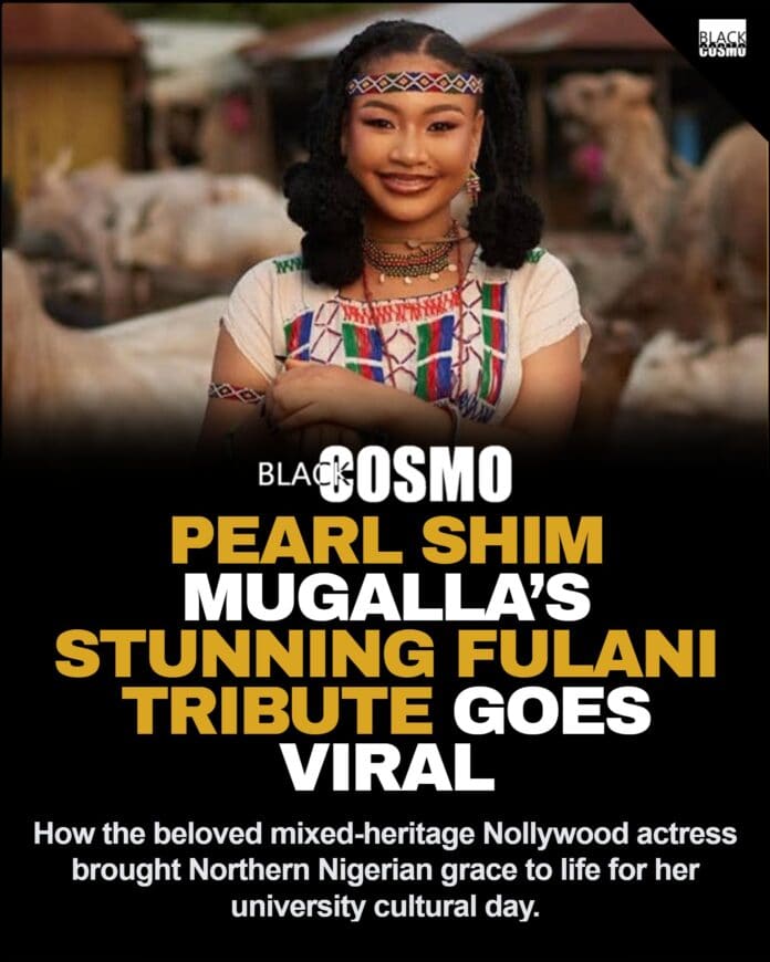 Pearl Shim Mugalla posing in traditional Fulani attire with a camel in a dusty Sahel landscape