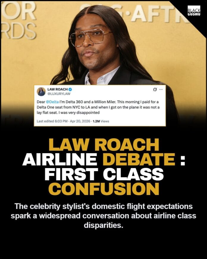 Law Roach posing on a red carpet.