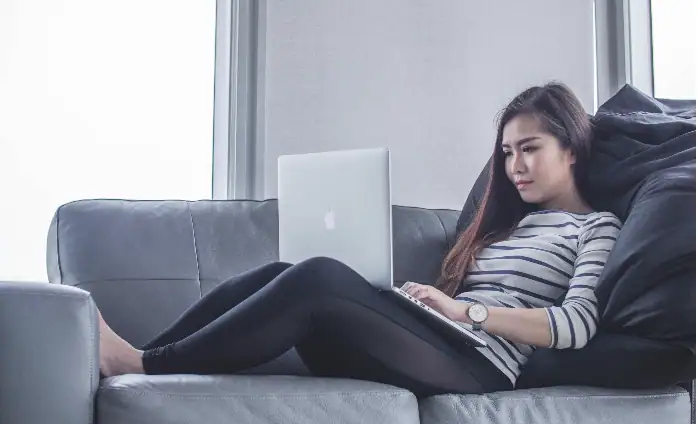 Woman on computer representing patient doing virtual EMDR therapy in Detroit