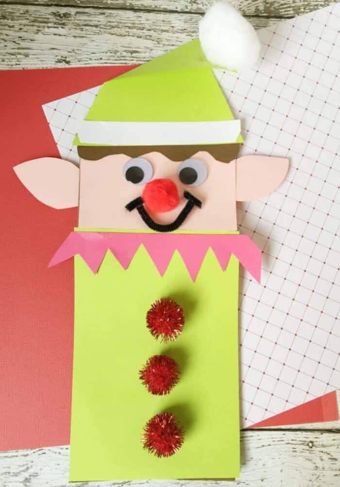 easy craft for kids featuring elf puppet made with paper bag