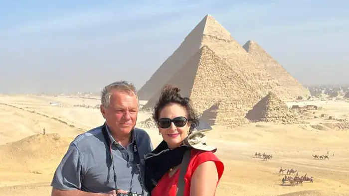 Travelers visiting the Giza Pyramids during an Egypt tour