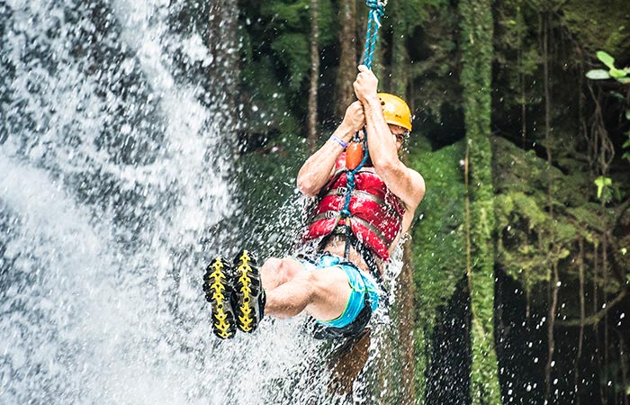 Tourists enjoying the ultimate One Day Adventure Pass at Hacienda Guachipelin in Guanacaste, Costa Rica.