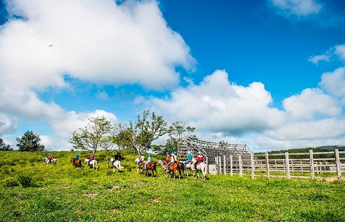 Tourists enjoying the ultimate One Day Adventure Pass at Hacienda Guachipelin in Guanacaste, Costa Rica.