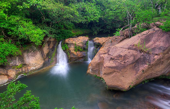 Tourists enjoying the ultimate One Day Adventure Pass at Hacienda Guachipelin in Guanacaste, Costa Rica.