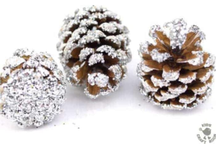 three pinecones with frosty paint