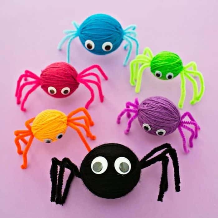 colorful spiders made with yarn and pipe cleaners